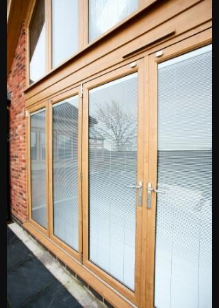 Liniar ModLok UPVC bi-fold door in an Irish Oak woodgrain finish